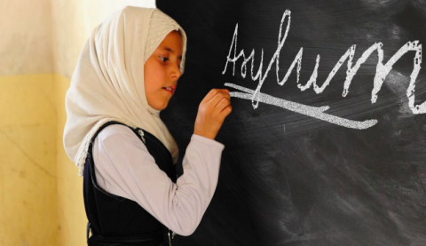 A girl writing on a blackboard